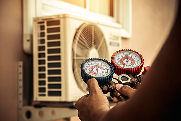 Professional Hvac Maintenance technician working in West Medford, MA